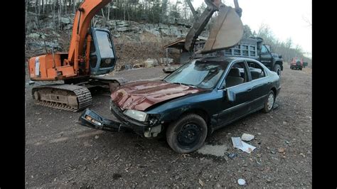 mini excavator smashing a car|Smashing car with an excavator .